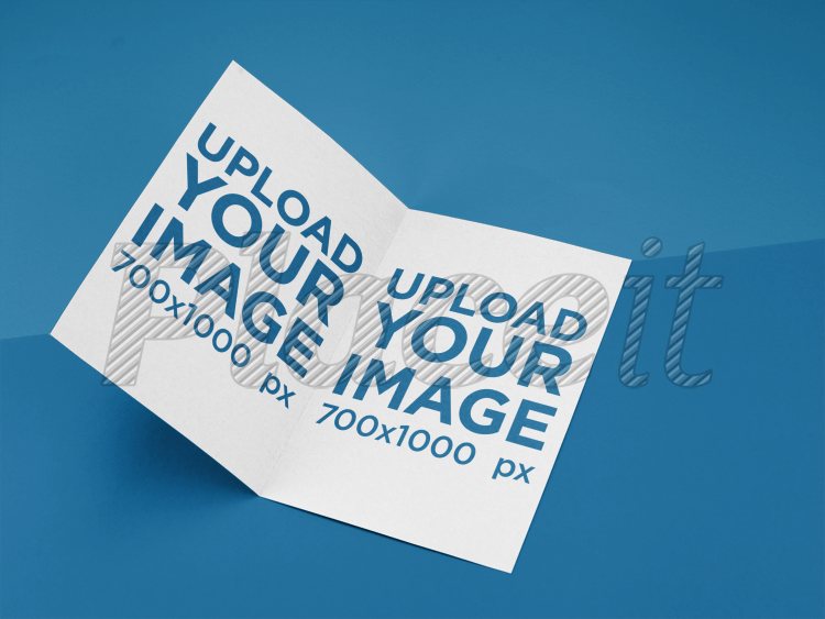placeit bifold brochure mockup lying on a bicolor surface