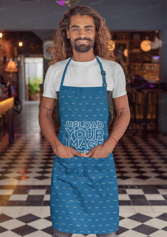 Placeit Apron Mockup Featuring A Tattooed Man With Long Hair